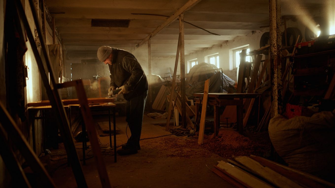 man working in dusty workshop