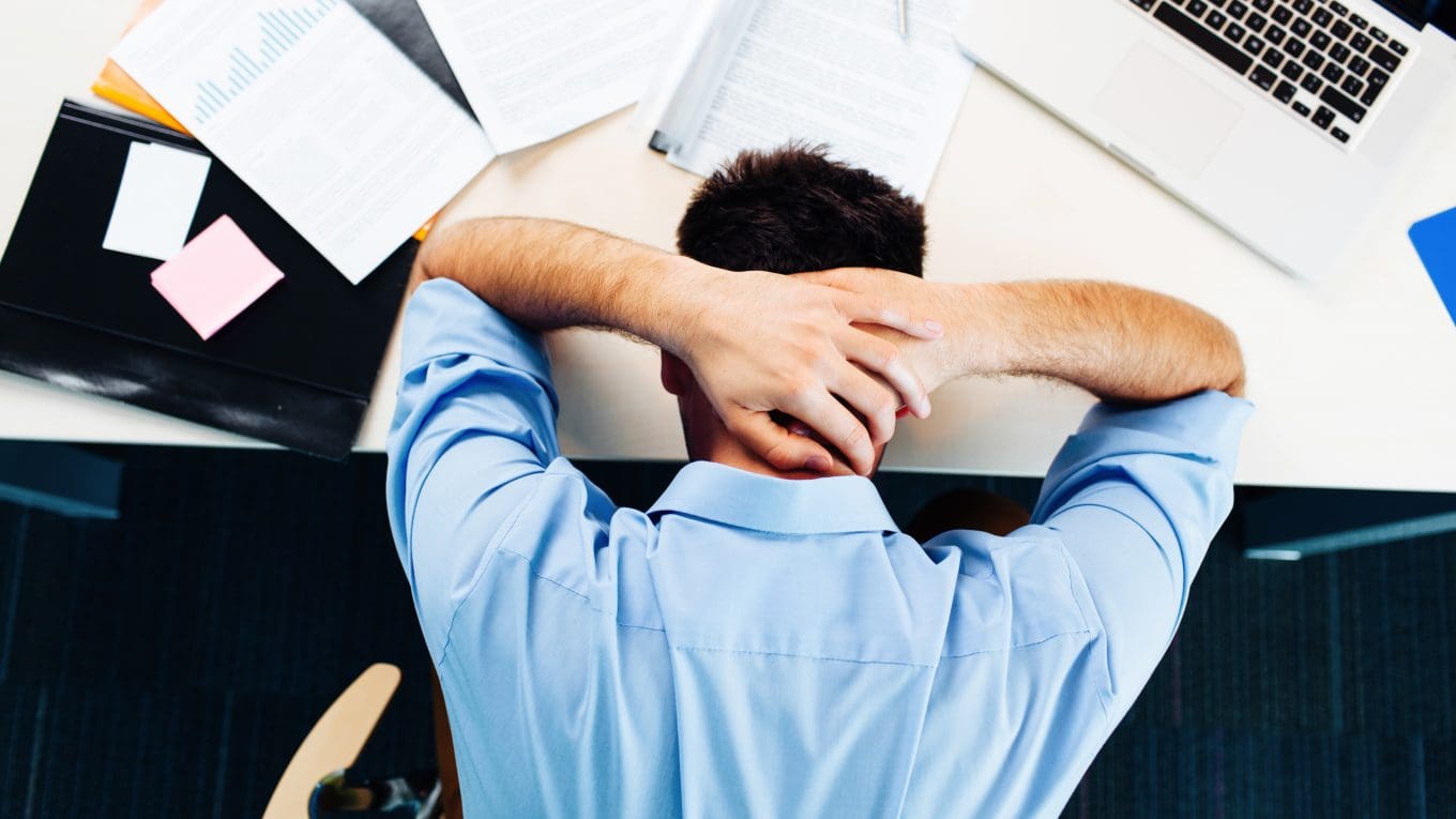 man stressed at desk