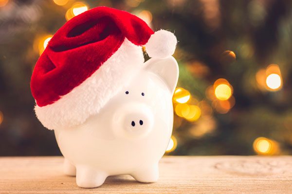 piggy bank with a christmas hat