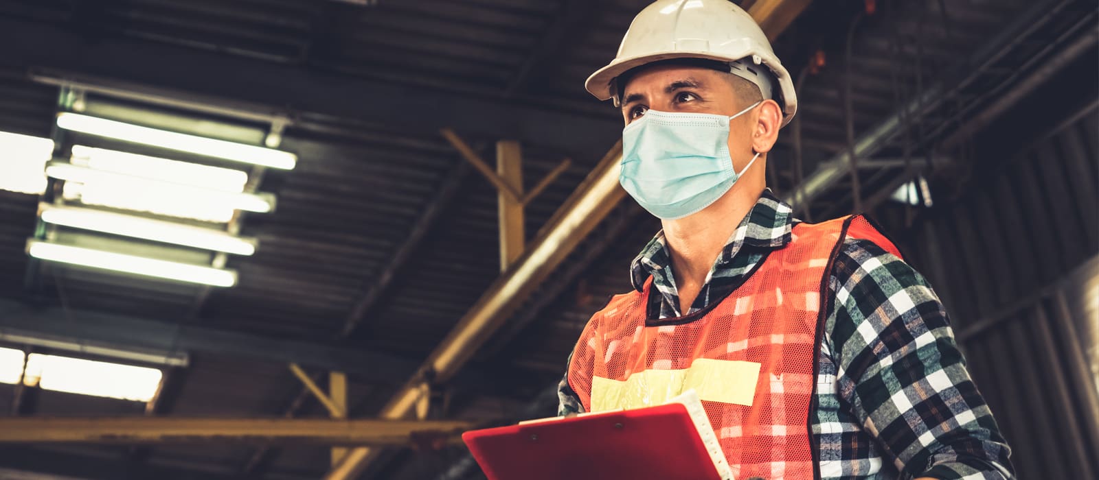 Personal Protective Equipment (PPE) -construction worker wearing a mask and helmet