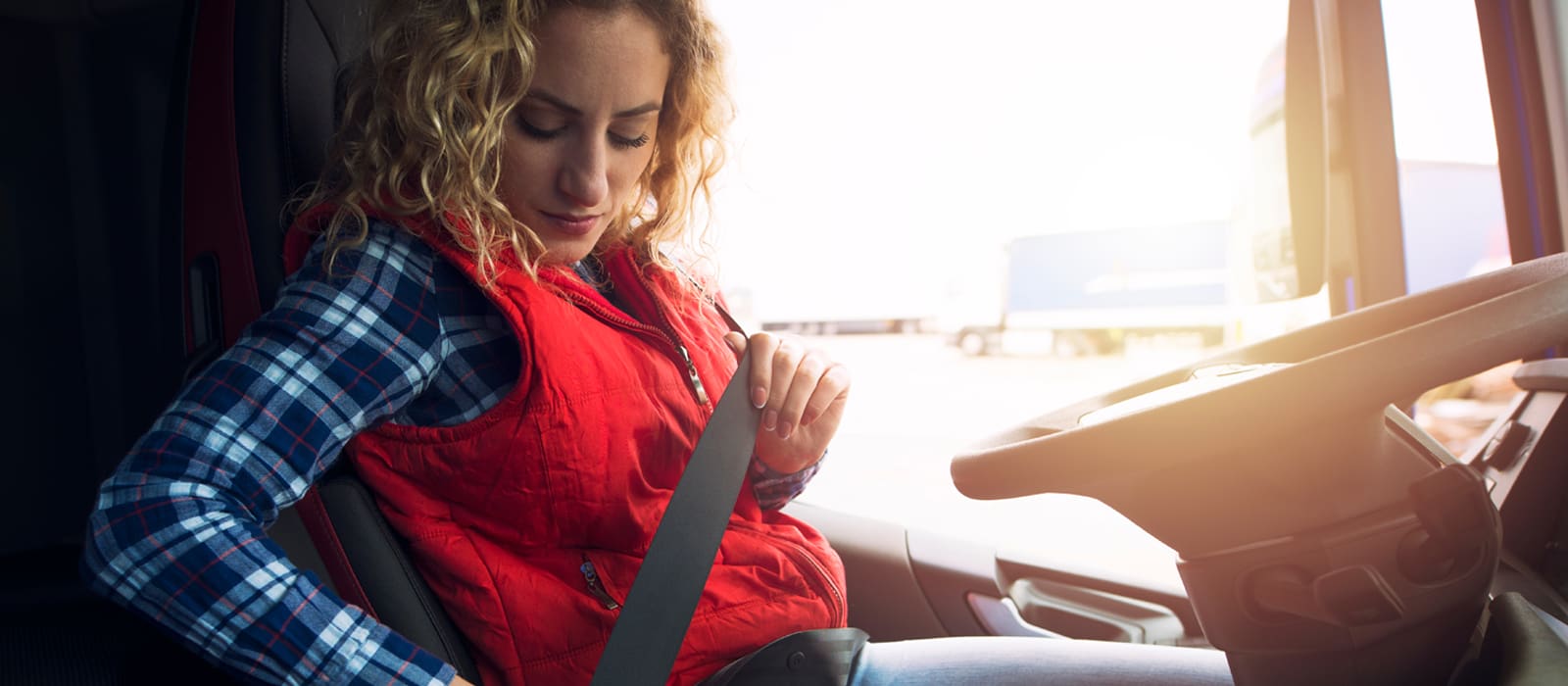 D4 Medicals - female fastening a seatbelt