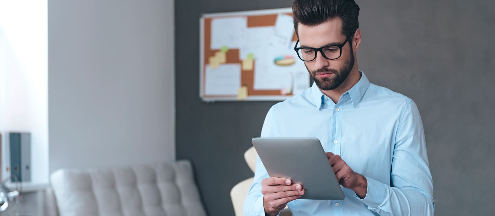 Placement Health Screening man with glasses using tablet