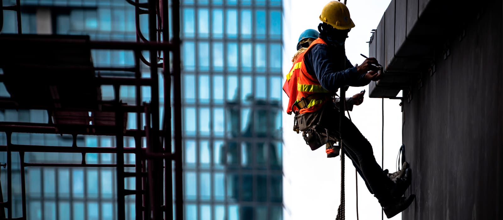 Safety Critical Medicals - workmen on side of building