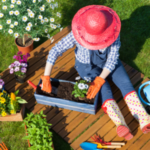 a lady in her garden doing her favourite hobby to improve her happiness