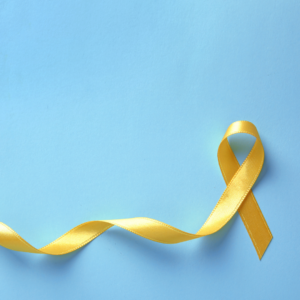 Yellow ribbon on blue background 
