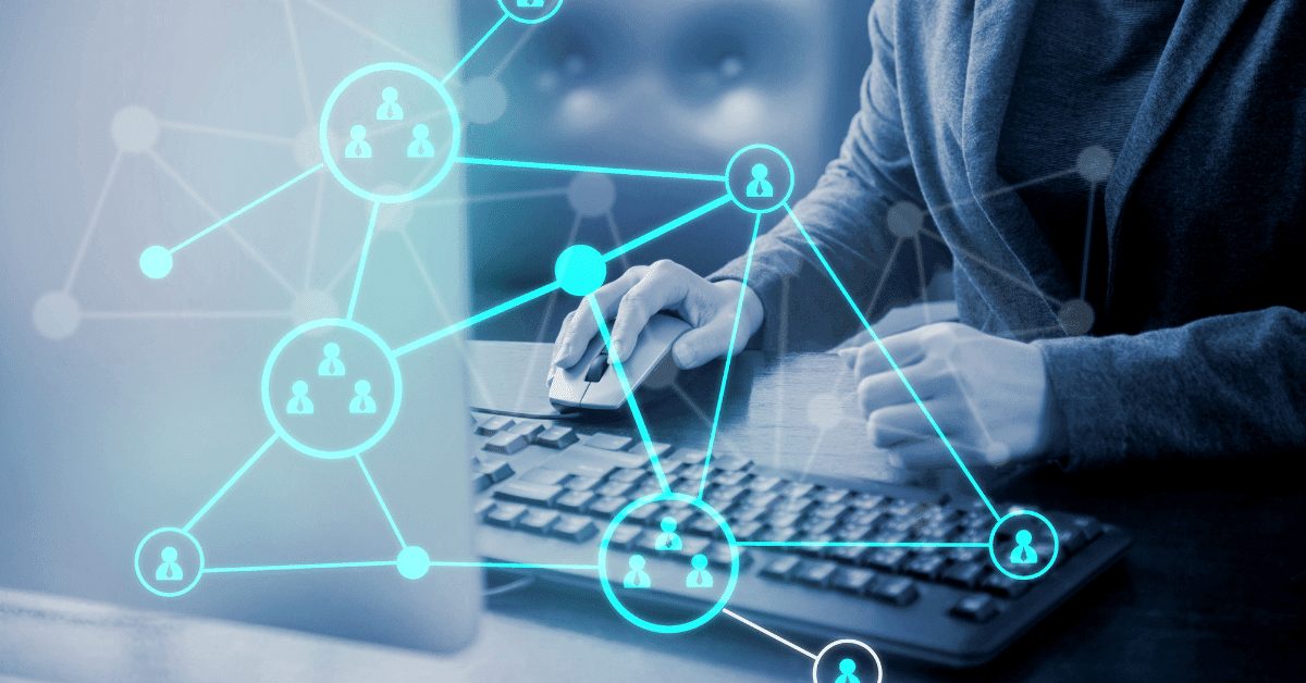 Hands at keyboard, with blue tone and networking overlay, suggesting networking and surveillance